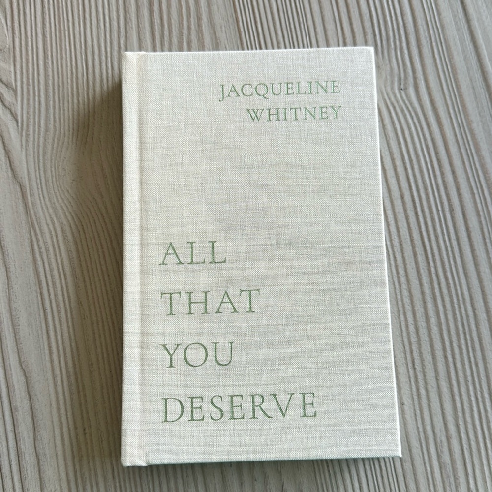Hard cover copy of “All That You Deserve” by Jacqueline Whitney